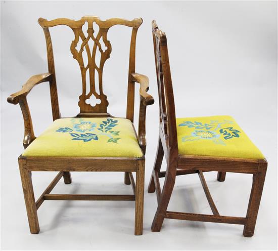 A set of ten elm country Chippendale style dining chairs,